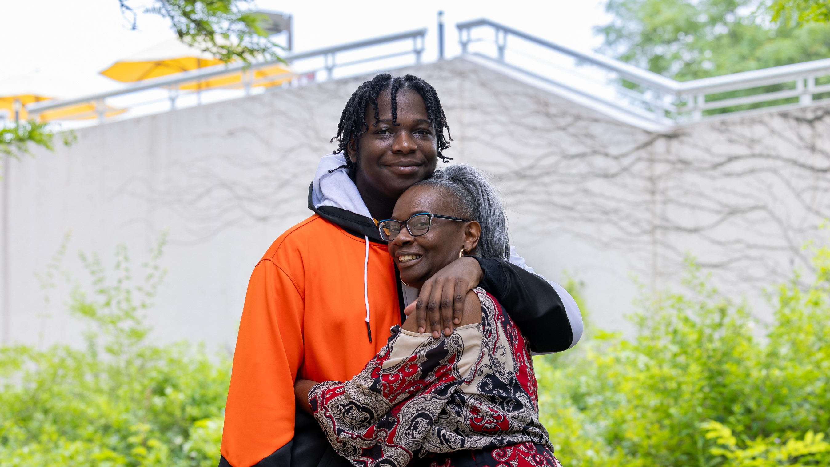 Barbara Hughes, embracing son, Zhakharius Holloway