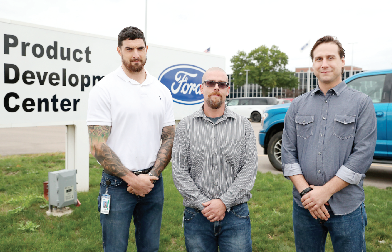 A partnership between Ford Motor Company and Washtenaw Community College that started at the North American International Auto Show resulted in new jobs for (from left) WCC student Anthony Smith, alumnus Kenneth Legg and student Marcus Malnar. (Photo by Kelly Gampel)